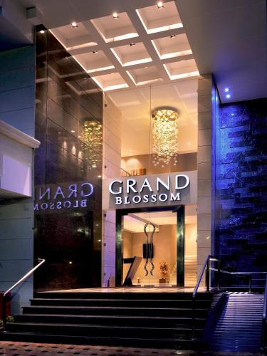 a grand blossom store with stairs in front of it at Radisson Mumbai Goregaon in Mumbai