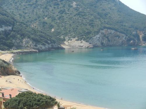 a view of a beach next to a mountain at Villa Giglio Rosso in Campese