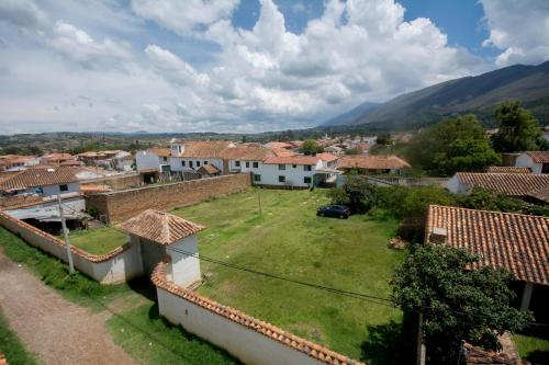 a view of a village with mountains in the background at Hotel Los Frayles in Villa de Leyva