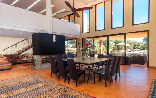 a dining room with a table and chairs at Villa Kristy in Marrakech