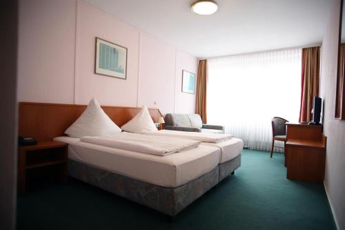 Säng eller sängar i ett rum på Hotel Lafayette