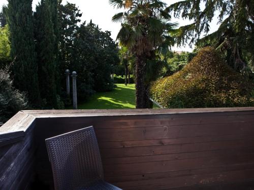 a chair sitting on top of a wooden fence at Hotel Due Mori in Cittadella