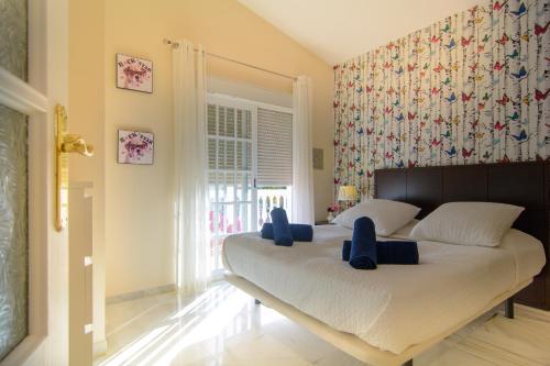 Katil atau katil-katil dalam bilik di Villa Las Chapas Playa