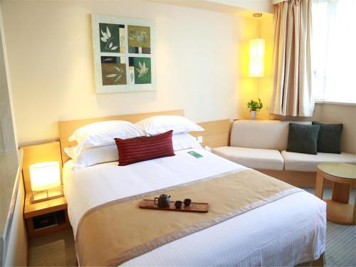 Postel nebo postele na pokoji v ubytování Jinglun Hotel Beijing