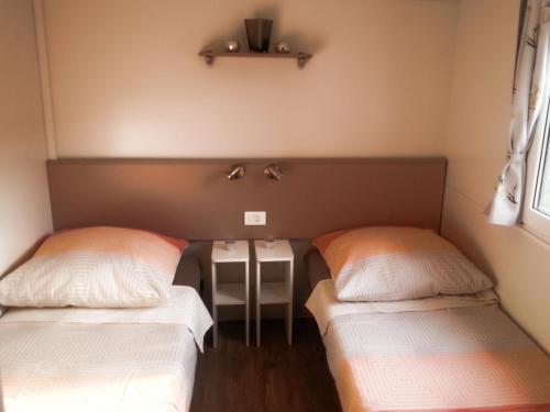 Postel nebo postele na pokoji v ubytování Mobile Homes Anita