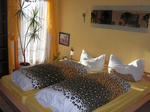 a bedroom with a bed with two pillows on it at Hotel Sternen in Lenzkirch