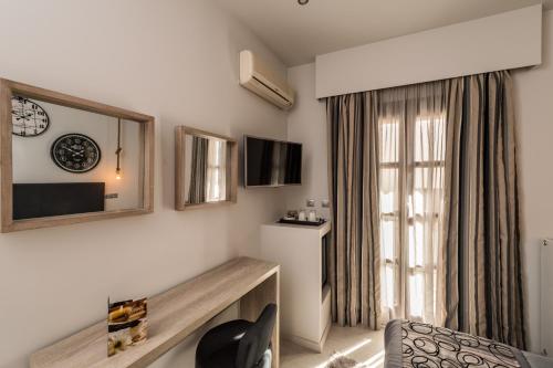a living room with a room with a window at Filoxenia Hotel & Spa in Kalavrita