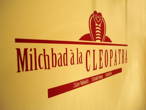 a sign on the side of a door with the ministry of colombia at AKZENT Hotel Bayerwald-Residenz in Neukirchen