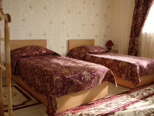 Un ou plusieurs lits dans un hébergement de l'établissement Hotel Pribrezhnaya