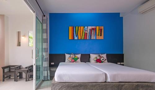 Ένα ή περισσότερα κρεβάτια σε δωμάτιο στο The Fong Krabi resort