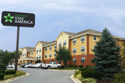 a sign in a parking lot in front of a building at Extended Stay America Suites - Baltimore - Bel Air - Aberdeen in Riverside