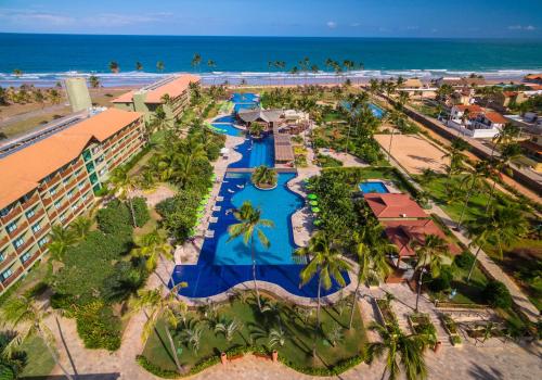 an aerial view of a resort with a pool and the beach at Vivá Porto de Galinhas Resort in Porto De Galinhas