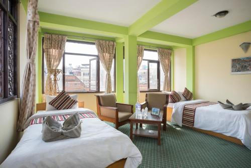 Postel nebo postele na pokoji v ubytování Hotel Yala Peak