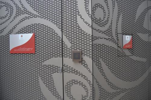 a wall with signs on the side of a building at Boutique Hotel Pfauen in Schorndorf