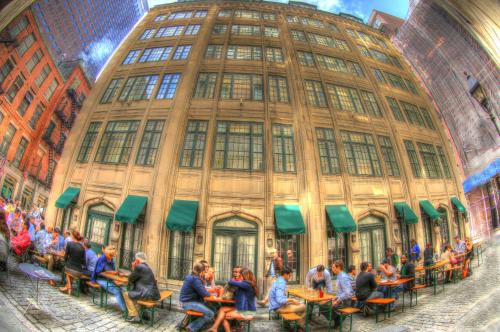 people sitting in front of a building at The Wall Street Inn in New York