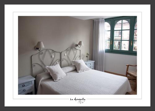 Ένα ή περισσότερα κρεβάτια σε δωμάτιο στο Hotel la Muñequilla