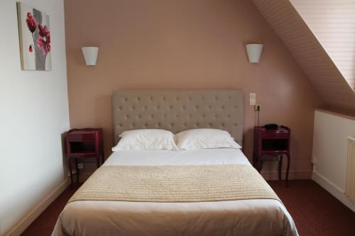 En eller flere senge i et værelse på Hôtel Moderne