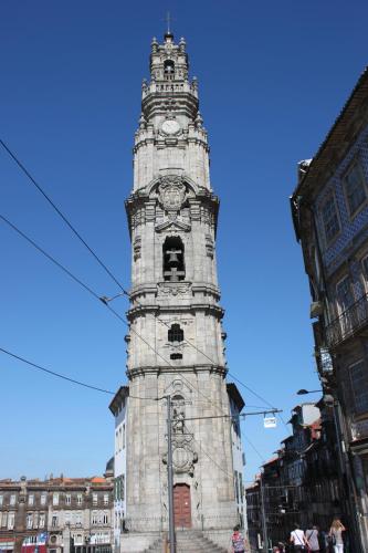 a clock tower in the middle of a city at Hotel Quasar in Porto