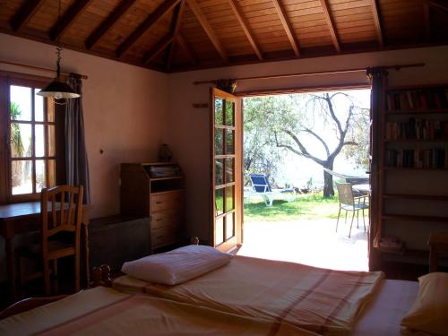 a bedroom with a bed and a door to a yard at Casa Mar in El Paso