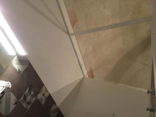 a shower in a bathroom with a ceiling at Palazzo Kapece in Monopoli