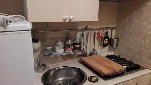 a kitchen counter with a pan on a stove at Villa Longo de Bellis in Bari