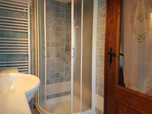 a bathroom with a shower and a sink at Bed And Breakfast Olimpia in San Salvatore Monferrato