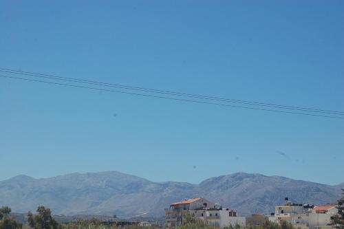 a view of mountains from a power line at Violetta Hotel in Amoudara Herakliou