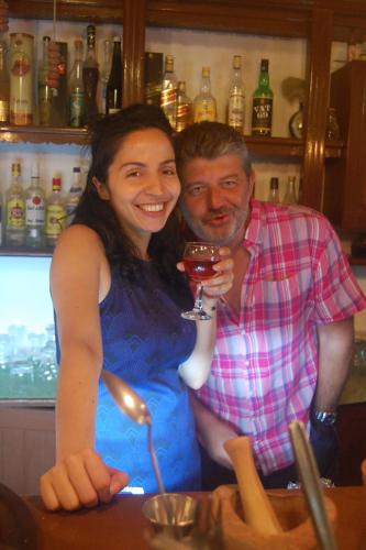 a man and a woman holding a glass of wine at Violetta Hotel in Amoudara Herakliou