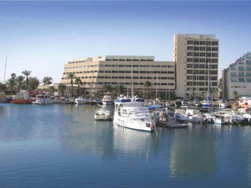 a bunch of boats are docked in a harbor at Caesar Premier Eilat Hotel in Eilat