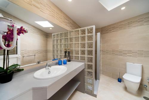 a bathroom with a sink and a toilet at Apartment Old Town in Puerto del Carmen