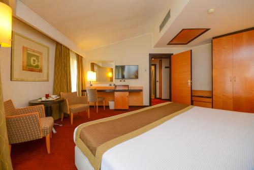 Postel nebo postele na pokoji v ubytování Hotel Igea