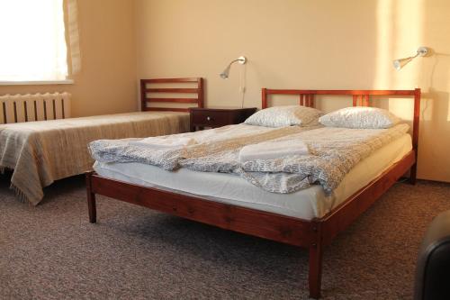 Ліжко або ліжка в номері Apartamenty Zacisze