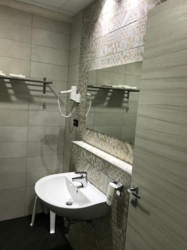 Ett badrum på Hotel Toscano