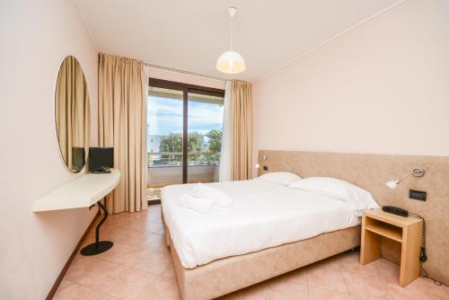 Posteľ alebo postele v izbe v ubytovaní Il Sogno Apartments