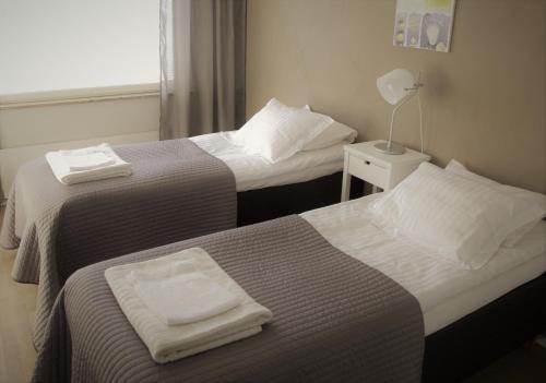 מיטה או מיטות בחדר ב-Apartments Rovakatu C19
