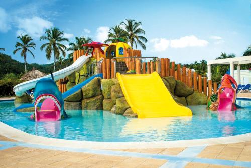 a water park with two slides in the water at Bahia Principe Grand El Portillo - All Inclusive in Las Terrenas