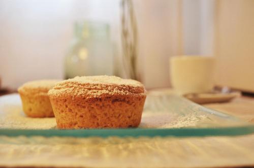 a muffin sitting on a plate on a table at B&B L'Alberone in Budrio