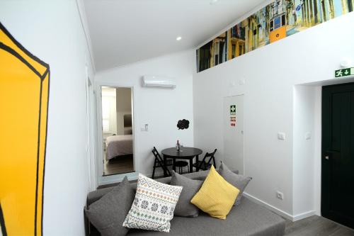 a living room with a couch and a table at Alfama Right Point in Lisbon