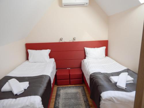 Кровать или кровати в номере Sport Hotel