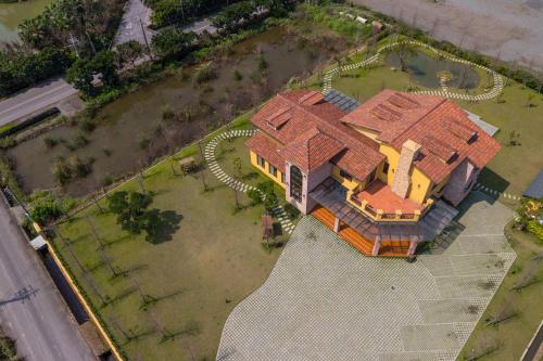 an overhead view of a large house with a yard at Charmole in Wujie