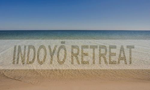 a sign on the beach that reads underwater at Indoyo Retreat in Busselton