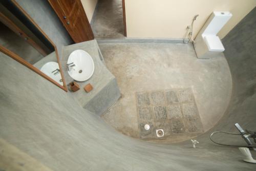 an overhead view of a bathroom with a sink at Anawasal in Kalpitiya