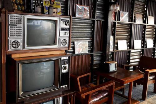 TV a/nebo společenská místnost v ubytování Smile Box Coffee & Resort