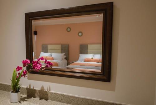 Una cama o camas en una habitación de Hotel Mumai