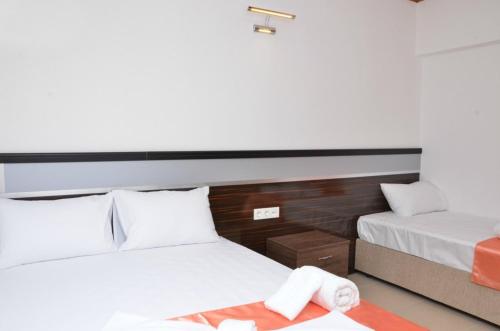 Postel nebo postele na pokoji v ubytování Ören Konak Otel