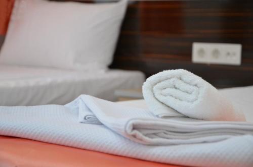 Postel nebo postele na pokoji v ubytování Ören Konak Otel