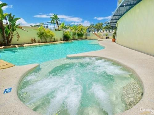 a swimming pool in the middle of a yard at Casablanca Penthouse Loft - Landmark 518 in Nelson Bay