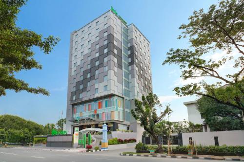 a rendering of a tall building at Ibis Styles Makassar Sam Ratulangi in Makassar