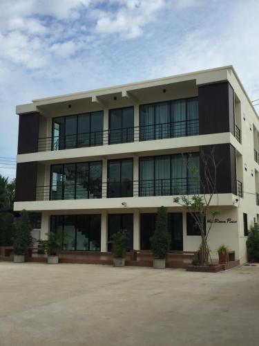 a black and white building with a lot of windows at Ma Room Place Sukhothai Resort in Sukhothai