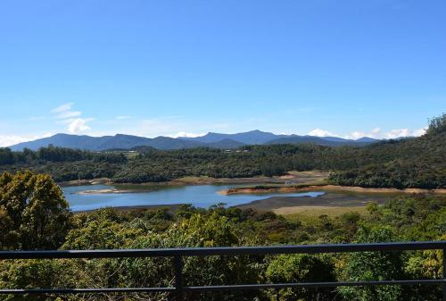 a view of a river with mountains in the background at Tranquil Villa in Nuwara Eliya